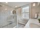 Bathroom featuring a stand-up glass shower, double sinks, and neutral walls at 712 Orange St, Indianapolis, IN 46203