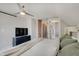 Bedroom featuring neutral walls, cozy carpet, and television at 712 Orange St, Indianapolis, IN 46203