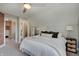 Bright bedroom featuring a comfortable bed, neutral walls, and a cozy carpet at 712 Orange St, Indianapolis, IN 46203