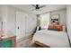 Cozy bedroom featuring a comfortable bed, area rug, neutral walls, and plenty of natural light at 712 Orange St, Indianapolis, IN 46203
