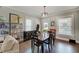 Dining room featuring hardwood floors, neutral walls and a stylish light fixture at 712 Orange St, Indianapolis, IN 46203