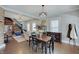 Dining room featuring hardwood floors, and open access to the living room and staircase at 712 Orange St, Indianapolis, IN 46203