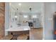 Modern kitchen with white cabinets, stainless steel appliances, and a breakfast bar with seating at 712 Orange St, Indianapolis, IN 46203