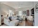 Comfortable living room with a large sectional couch and hardwood floors at 712 Orange St, Indianapolis, IN 46203