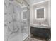 Modern bathroom with glass shower, sleek vanity, and stylish mirror at 714 S Keystone Ave, Indianapolis, IN 46203