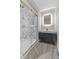 Chic bathroom featuring a glass shower, elegant vanity, and lighted mirror at 714 S Keystone Ave, Indianapolis, IN 46203