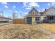 A quaint blue home featuring a welcoming yellow front door and manicured yard at 714 S Keystone Ave, Indianapolis, IN 46203
