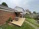 Cozy backyard deck featuring a table, plants, and a charming outdoor seating area at 7392 S Meridian St, Indianapolis, IN 46217