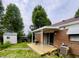 Cozy backyard deck featuring a table, plants, and a charming outdoor seating area at 7392 S Meridian St, Indianapolis, IN 46217