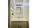 Bright bathroom featuring a stylish sink vanity, built-in shelves, and neutral tones at 7392 S Meridian St, Indianapolis, IN 46217