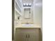 Bathroom featuring a sleek white vanity, modern lighting, and built-in shelving at 7392 S Meridian St, Indianapolis, IN 46217