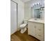 Bathroom with a vanity, large mirror, and a commode, all with clean, neutral finishes at 7392 S Meridian St, Indianapolis, IN 46217