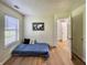 Minimalist bedroom with a platform bed, natural light, and a decorative wall map at 7392 S Meridian St, Indianapolis, IN 46217