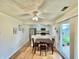 Cozy dining area featuring a wooden table with four chairs, adjacent to a modern kitchen and patio door at 7392 S Meridian St, Indianapolis, IN 46217