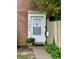 Close-up of the front door with house number and lush greenery at 7392 S Meridian St, Indianapolis, IN 46217