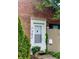 Close-up of the front door with house number and lush greenery at 7392 S Meridian St, Indianapolis, IN 46217
