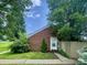 Charming single-Gathering home with brick facade and well-maintained front yard with mature trees at 7392 S Meridian St, Indianapolis, IN 46217