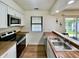 Clean kitchen featuring stainless steel appliances, sleek countertops, and ample natural light at 7392 S Meridian St, Indianapolis, IN 46217