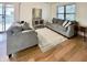 Spacious living room featuring two sofas, a stylish rug, and hardwood floors, creating a comfortable atmosphere at 7392 S Meridian St, Indianapolis, IN 46217
