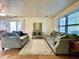 Bright living room featuring two sofas, a stylish rug, and a center table, with natural light from a window at 7392 S Meridian St, Indianapolis, IN 46217