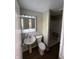 The bathroom is equipped with a modern sink, toilet, shower, and vanity mirror, providing convenience and style at 7641 E 35Th St, Indianapolis, IN 46226