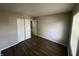Cozy bedroom with wood flooring, closet, neutral paint and a window for natural light at 7641 E 35Th St, Indianapolis, IN 46226