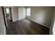 This bedroom features modern wood flooring, closet, fresh paint and a window for natural light at 7641 E 35Th St, Indianapolis, IN 46226