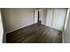 Bright bedroom featuring wood flooring, closet, neutral paint and a window for natural light at 7641 E 35Th St, Indianapolis, IN 46226