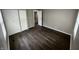 Comfortable bedroom with modern wood flooring, closet, fresh paint and lots of natural light at 7641 E 35Th St, Indianapolis, IN 46226