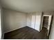 This is a bedroom featuring neutral paint, wood flooring, and a closet for storage at 7641 E 35Th St, Indianapolis, IN 46226