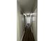 Hallway featuring wood flooring, fresh paint, modern lighting and neutral colors at 7641 E 35Th St, Indianapolis, IN 46226