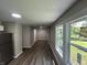 The home's interior showcases a modern living space with dark flooring, freshly painted walls, and plenty of natural light at 7641 E 35Th St, Indianapolis, IN 46226