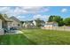 Manicured backyard with lush lawn, shed, and partial patio seating area at 8028 Meadow Bend Ln, Indianapolis, IN 46259