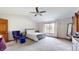 Bedroom boasts a neutral color palette, soft carpet, and vaulted ceilings with a ceiling fan at 8028 Meadow Bend Ln, Indianapolis, IN 46259