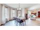 Dining room features bright natural light from three windows and flows into the living room at 8028 Meadow Bend Ln, Indianapolis, IN 46259