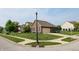 Well-maintained home with brick exterior, manicured lawn, and mature trees at 8028 Meadow Bend Ln, Indianapolis, IN 46259