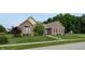 Charming single-story brick home with manicured lawn and mature landscaping in a quiet neighborhood at 8028 Meadow Bend Ln, Indianapolis, IN 46259