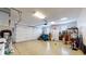Spacious two-car garage with ample storage space and a bright overhead light at 8028 Meadow Bend Ln, Indianapolis, IN 46259
