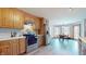 Modern kitchen with wood cabinets, stainless steel appliances, and an adjacent dining area perfect for entertaining at 8028 Meadow Bend Ln, Indianapolis, IN 46259