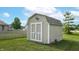 Backyard shed offers additional storage space with double doors and easy access at 8028 Meadow Bend Ln, Indianapolis, IN 46259