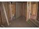 Unfinished bathroom displaying the stud framing, plumbing, and future design layout at 827 W 9Th St, Anderson, IN 46016
