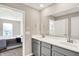Elegant bathroom featuring dual sinks, modern vanity, and a view into the bedroom at 851 Sonoma Ln, Greenfield, IN 46140
