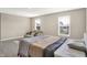 Sun-filled Primary bedroom featuring a seating area, bed and plush carpeting at 851 Sonoma Ln, Greenfield, IN 46140