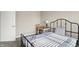 A cozy bedroom featuring a bed, a window, a desk and a comfortable chair at 851 Sonoma Ln, Greenfield, IN 46140