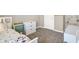 This bedroom has a twin bed with gray carpet, a dresser and a door to the hallway at 851 Sonoma Ln, Greenfield, IN 46140