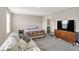 Bright Primary bedroom featuring a comfortable sofa, bed, and stylish wooden dresser at 851 Sonoma Ln, Greenfield, IN 46140