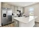 Bright kitchen features stainless steel appliances, light gray cabinets, and a center island with a sink at 851 Sonoma Ln, Greenfield, IN 46140