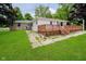 Spacious backyard with a wooden deck and lush green lawn at 91 N Raceway Rd, Indianapolis, IN 46234