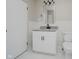 Bathroom features a modern vanity with granite countertop and a sleek, black faucet at 91 N Raceway Rd, Indianapolis, IN 46234