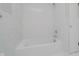 Clean white bathroom featuring white tile and bright lighting at 91 N Raceway Rd, Indianapolis, IN 46234